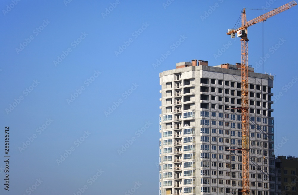 Kiev, Ukraine - February 17, 2019: The construction of a new monolithic multi-storey building. Unfinished building сonstruction. Construction site with crane. Modern apartment building Kiev, Ukraine - February 17, 2019: The construction of a new monolithic multi-storey building. Unfinished building сonstruction. Construction site with crane. Modern apartment building