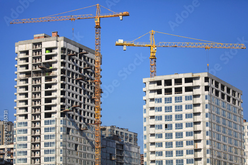 Kiev, Ukraine - February 17, 2019: The construction of a new monolithic multi-storey buildings. Unfinished building сonstruction. Construction site with cranes. Modern apartment buildings