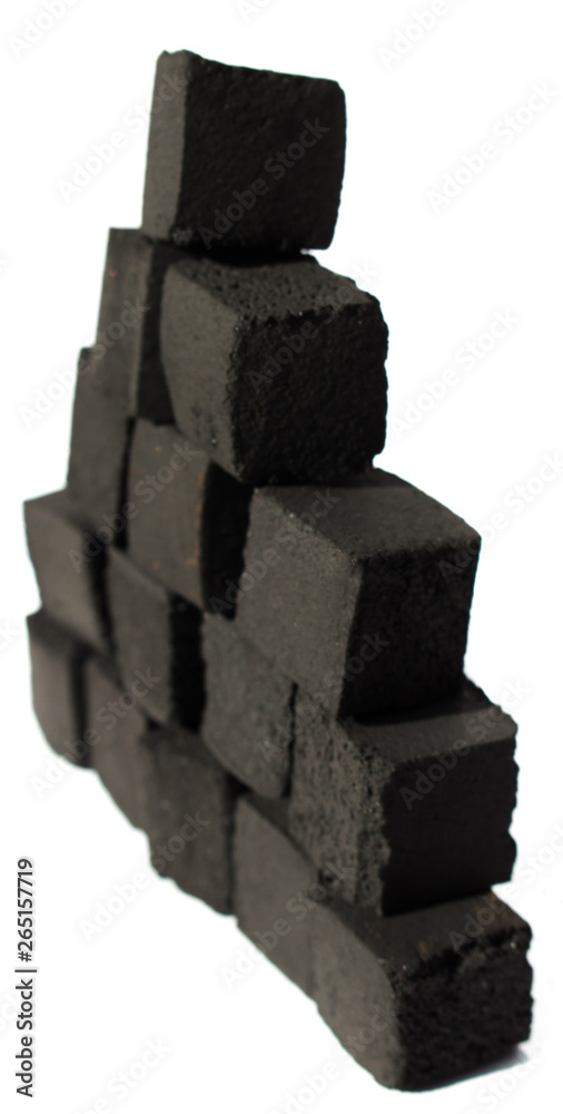 Coconut coals for hookah on a white background