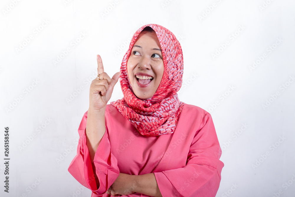 Asian muslim businesswomen wearing hijab with curiousity thinking expression. Having good idea. Close up head and shoulders Asian muslim businesswomen wearing hijab with curiousity thinking expression. Having good idea. Close up head and shoulders