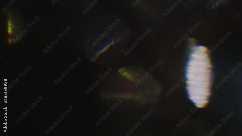 Psychedelic colorful bokeh shining in the dark. 