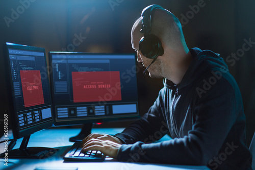 Cuadro en lienzo cybercrime, hacking and technology concept - male hacker in headset with access