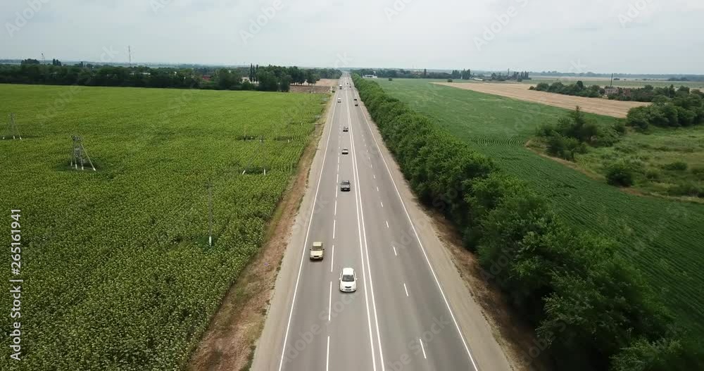 Aerial fly over motorway, freeway traffic - trucks and cars on the road. Aerial fly over motorway, freeway traffic - trucks and cars on the road.