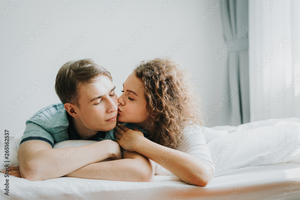 lovely couple in love kissing in bed lovely couple in love kissing in bed