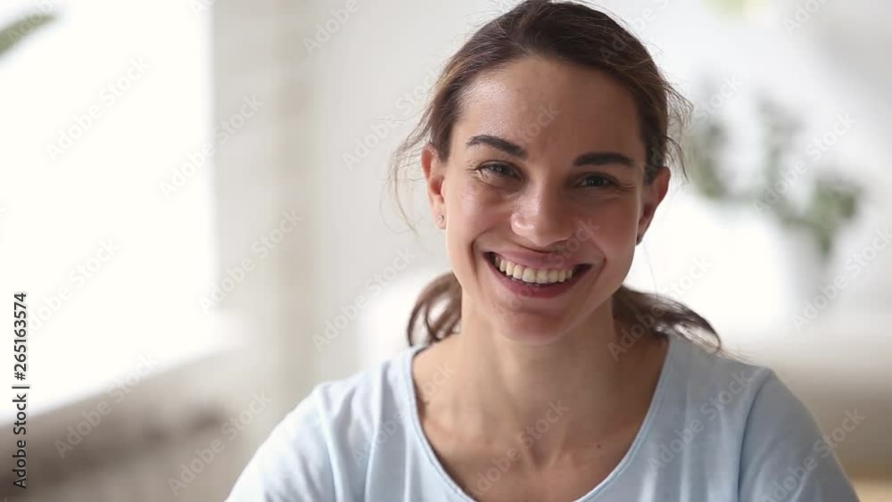 Happy young attractive woman with beautiful face looking at camera Happy young attractive woman with beautiful face looking at camera