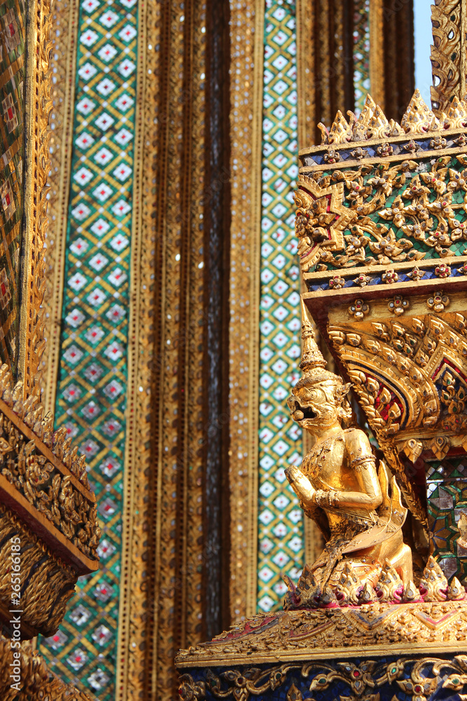 facade (detail) of a building in a buddhist temple (Wat Phra Kaeo) in bangkok (thailand)