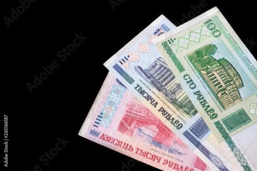 Outdated Belarusian rubles isolated on black close up © Talulla