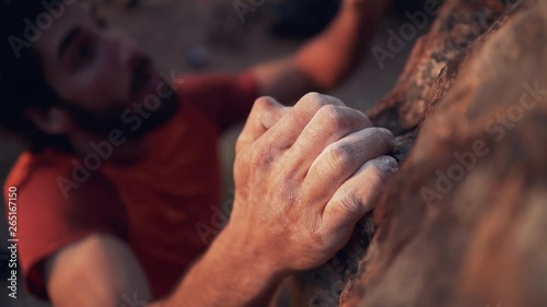 High Angle View Of Climbers hand Climbing On Cliff