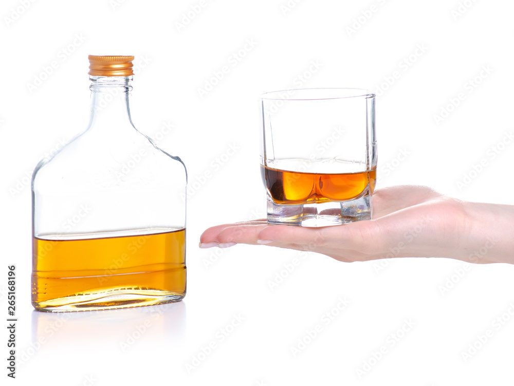Glass with cognac and bottle cognac on a white background. Isolation Glass with cognac and bottle cognac on a white background. Isolation