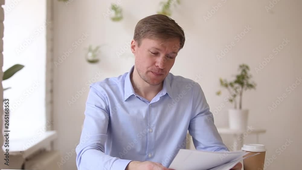 Successful businessman speaking to camera making business conference video call Successful businessman speaking to camera making business conference video call