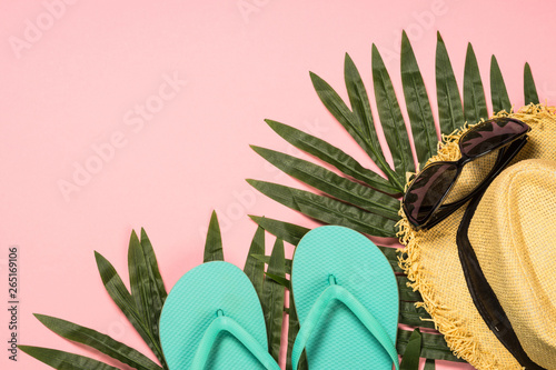 Summer holiday flat lay background on pink.