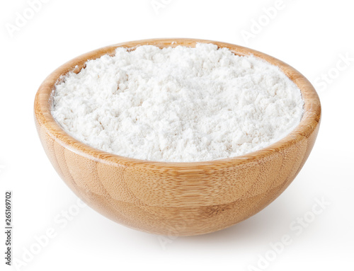 Wheat flour in wooden bowl isolated on white background with clipping path