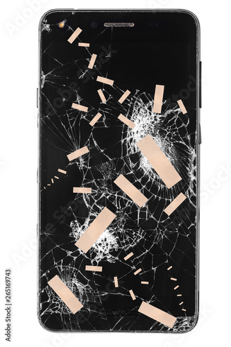 Broken mobile phone / cellphone / smartphone screen with patch stitches isolated on white background