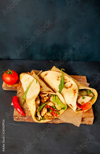 delicious mexican tacos with salad on concrete background. mexican cuisine