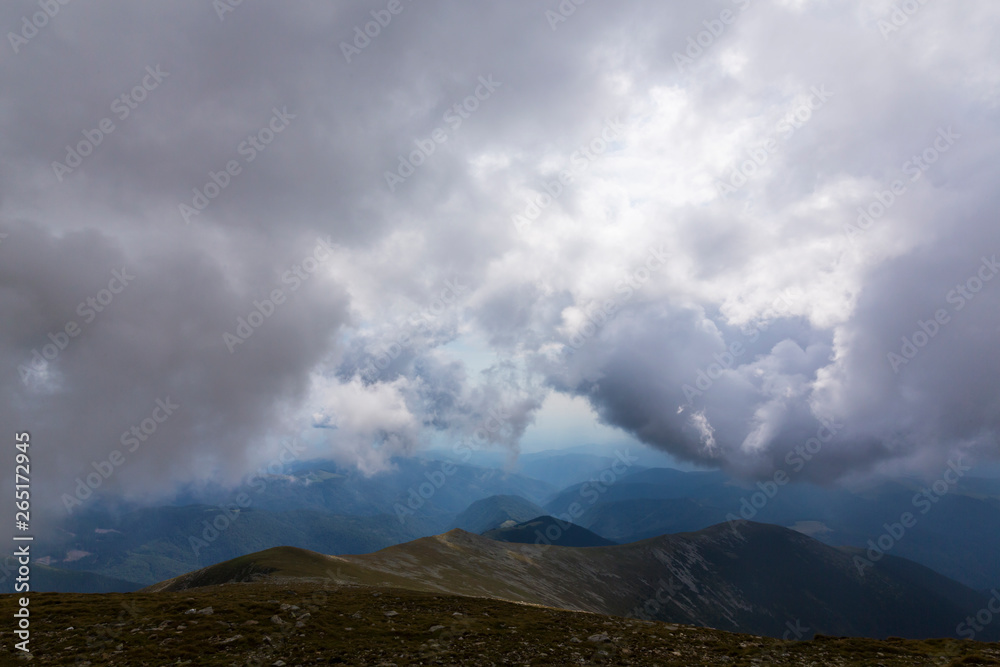 Mist and storm clouds in the mountains, in summer