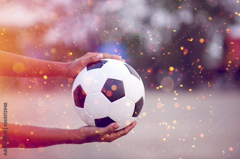 Fototapeta premium The cropped image of sports players who catch the ball and the football field. Sports-image concept.