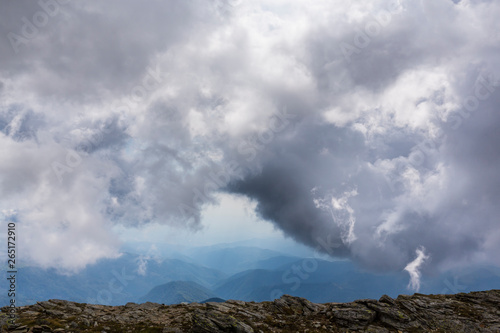 Mist and storm clouds in the mountains, in summer