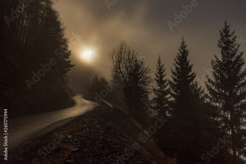 mysterious mountain road in the fog