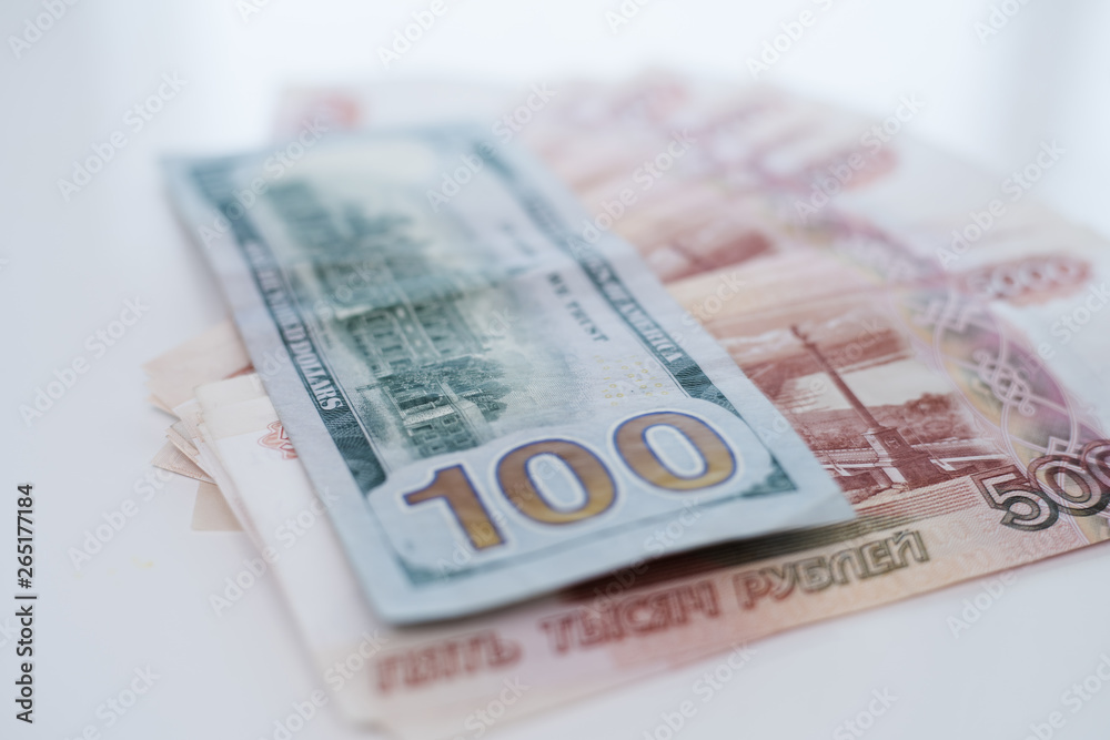 Five thousand rubles and one hundred dollars. The concept of trading, the concept of exchange rate. Five thousand rubles and one hundred dollars. The concept of trading, the concept of exchange rate.