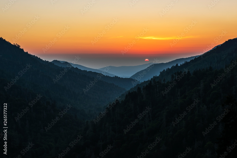 Sunset at Morton's Overlook below Newfound Gap on the border of Tennessee and North Carolina. The mist of the ancient Smoky Mountains glows in the setting sun.