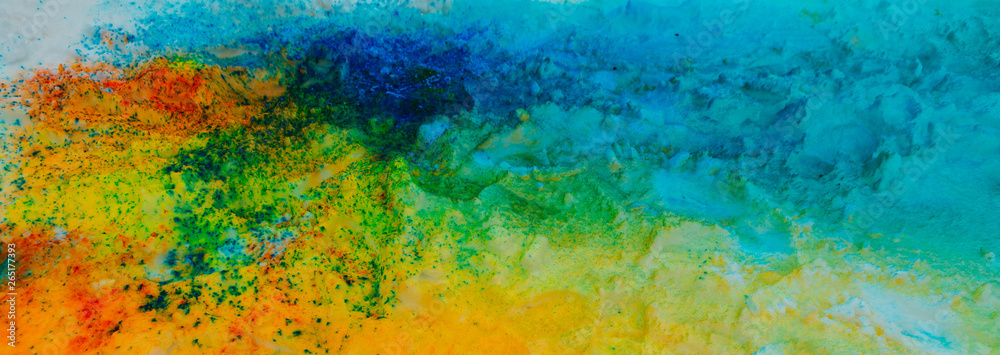 Banner background of colorful Holi powder on the snow