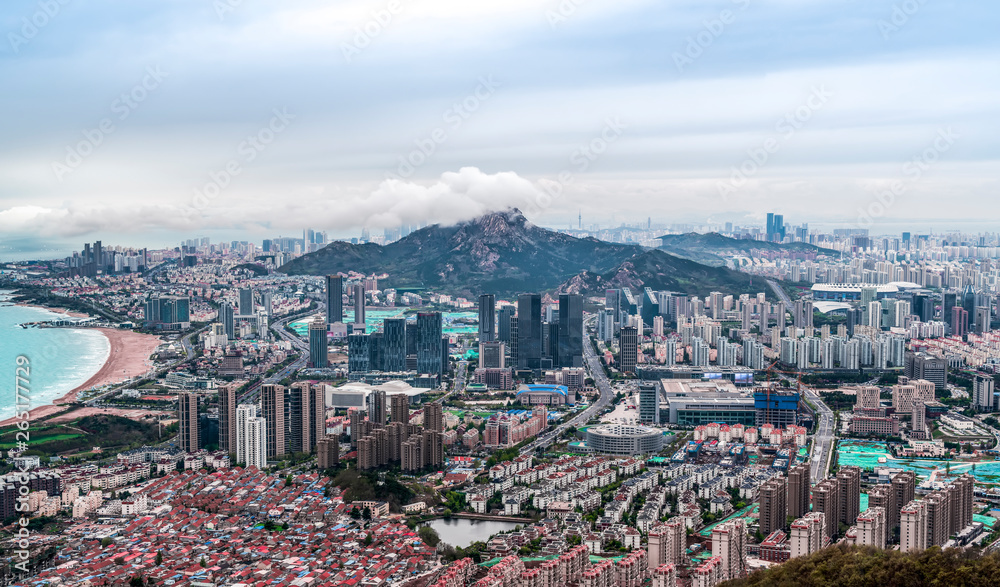 Fototapeta premium A bird's eye view of Qingdao coastline and urban skyline..