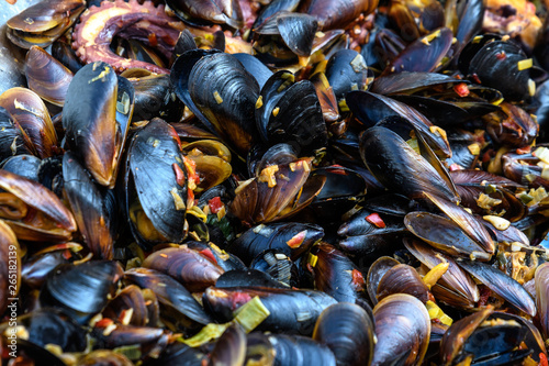 Close up of cooked mussels at a street food festival, ready to eat seafood