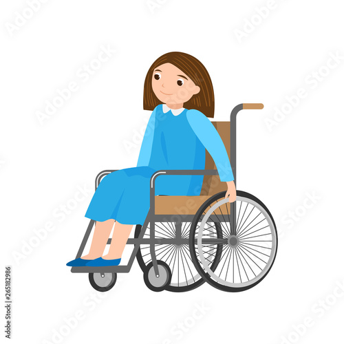 Cute smiling woman in blue dress moving in wheelchair