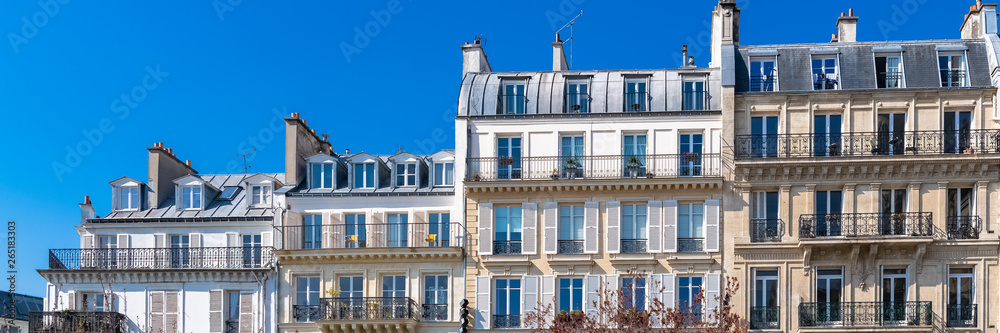 Paris, beautiful buildings in the center, typical parisian facades in the Marais  - obrazy, fototapety, plakaty 