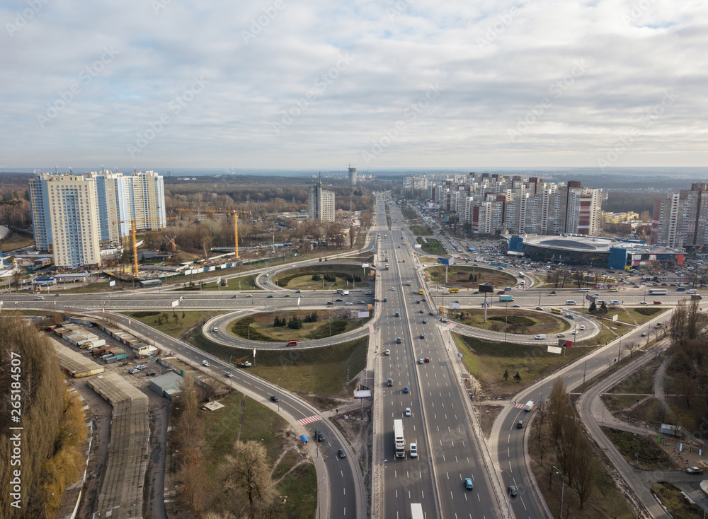Modern city with of Odessa square and road in the form of a quatrefoil on a background of a cloudy sky . Aerial view from the drone. Kiev, Ukraine