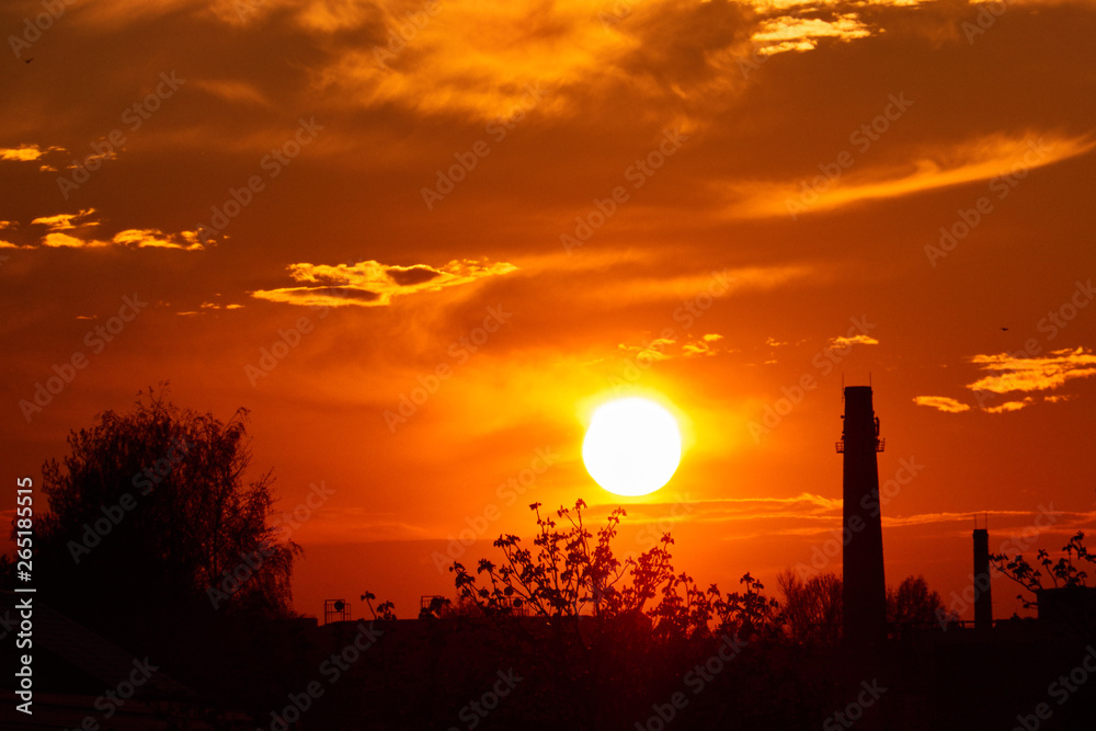 Factory chimney industry in evening sunset background,