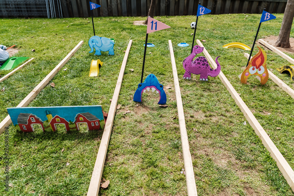Fototapeta premium Valencia, Spain - April 29, 2019: Portable mini-golf placed on the lawn for children's fun.