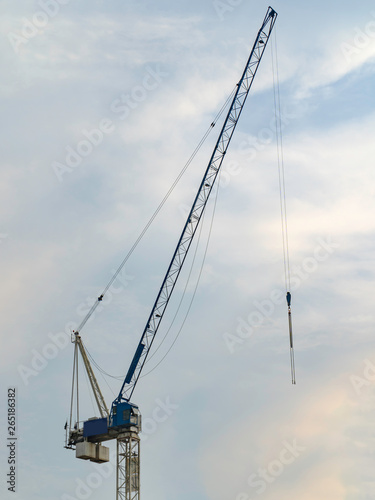 under construction blue crane with sky background