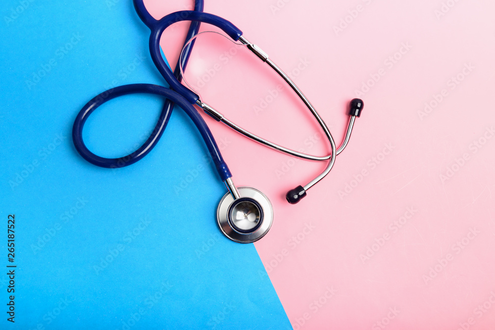 Stethoscope between blue and red areas, the concept of healthy and unhealthy lifestyle Stethoscope between blue and red areas, the concept of healthy and unhealthy lifestyle