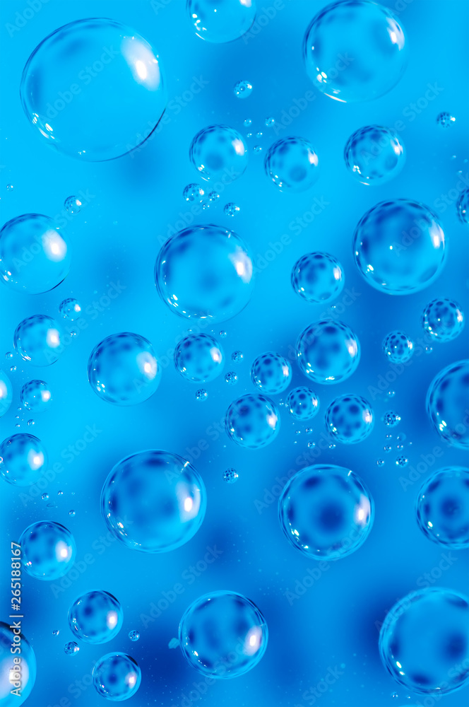 Macro air bubbles in water on a blue background Macro air bubbles in water on a blue background