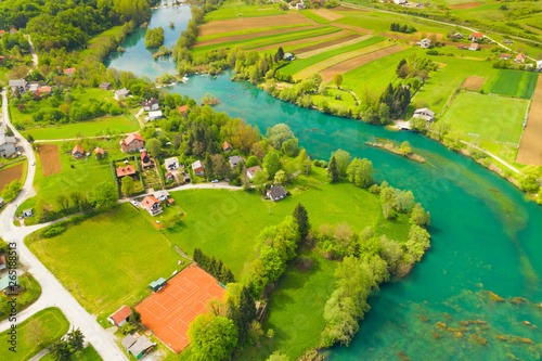 Fototapeta Naklejka Na Ścianę i Meble -  Croatian countryside landscape, beautiful green Mreznica river from air, panoramic view of Belavici village and waterfalls in spring, popular tourist destination