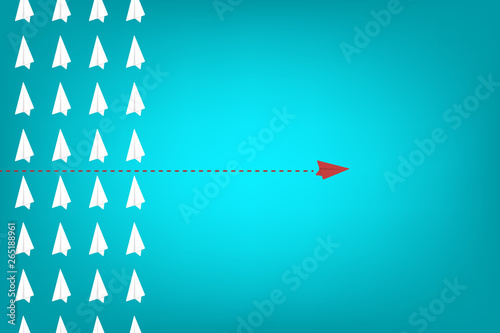 Think different. Think differently concept. Red airplane changing direction. New idea, change, trend, courage, creative solution, innovation and unique way concept.	