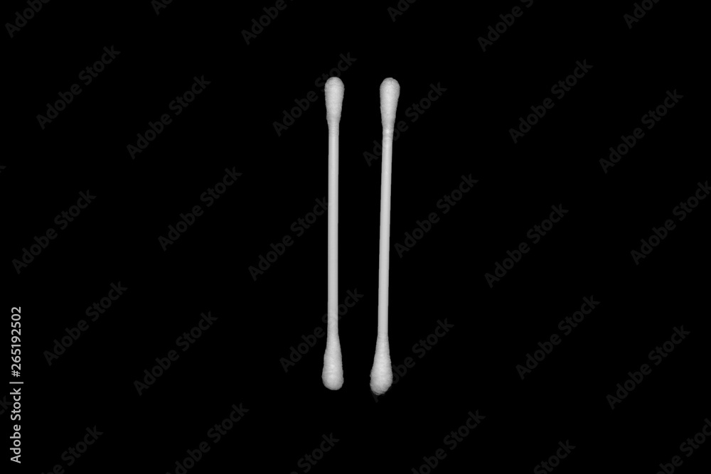 White cotton buds isolated on black background White cotton buds isolated on black background