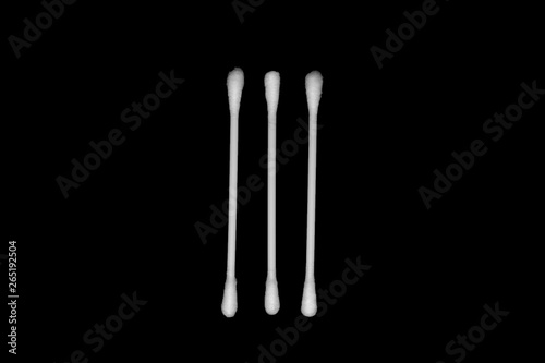 White cotton buds isolated on black background