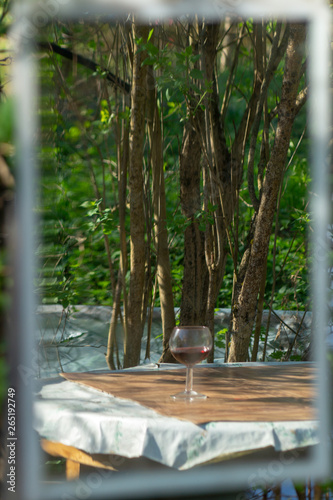 glass of red wine in mirror