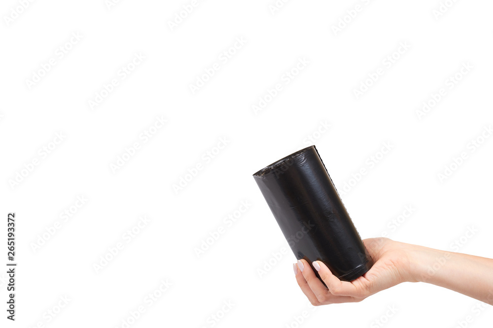 hand with roll of black plastic garbage bags for trash hand with roll of black plastic garbage bags for trash