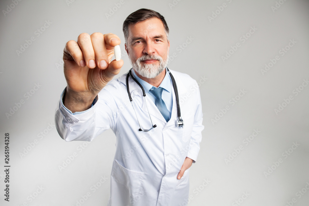 healthcare and medical concept - doctor with pill in hospital healthcare and medical concept - doctor with pill in hospital