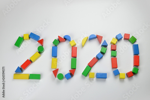 number of the year 2020 written with colorful yellow, green, red and blue toy wooden blocks