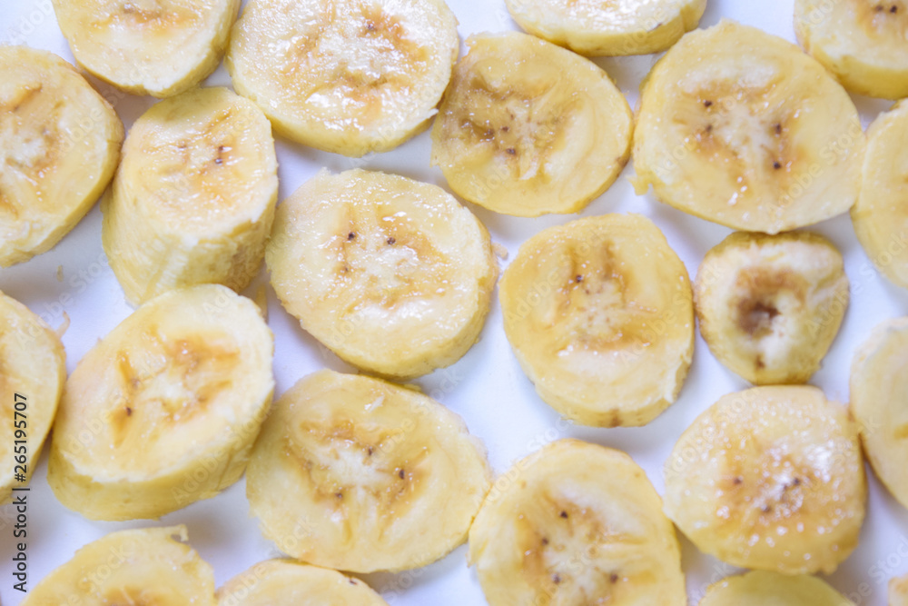 Close up slice yellow banana isolated on white background