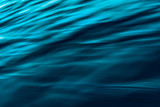 Abstract Background, Water Surface. Dark Blue. Play of Ripples
