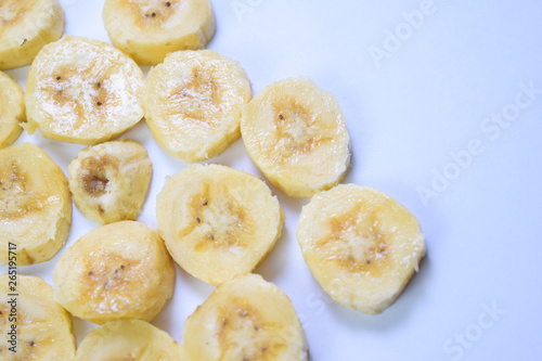 Close up slice yellow banana isolated on white background © syahrir