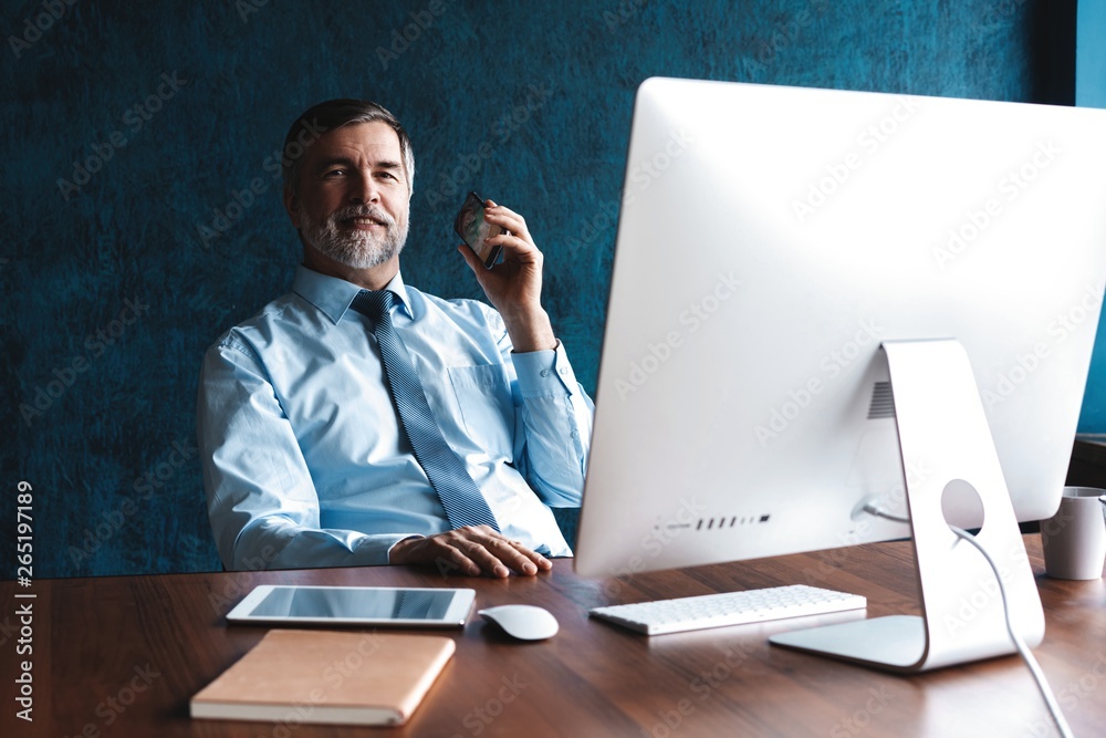 Mature Businessman Working On Computer In Office Mature Businessman Working On Computer In Office