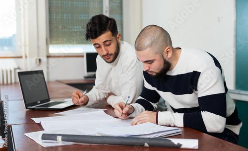 Students preparing for exams in classroom