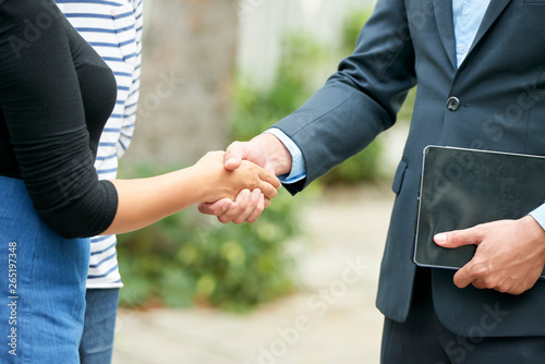 Business handshake outdoors
