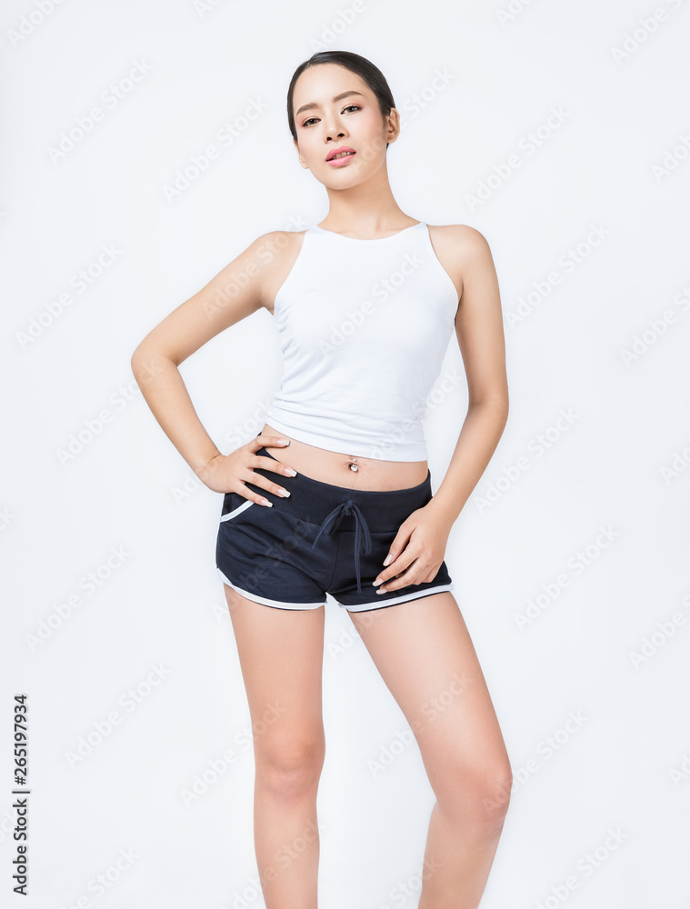 Portrait of beautiful healthy asian woman body curve with sport wear copy  space on white background. People beauty perfect body slim fitness girl.  Freedom happy and relax lifestyle healthcare concept Stock Photo